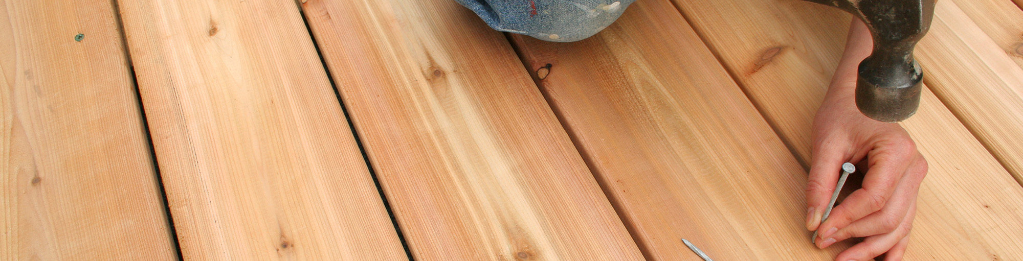 Wooden decking being nailed down